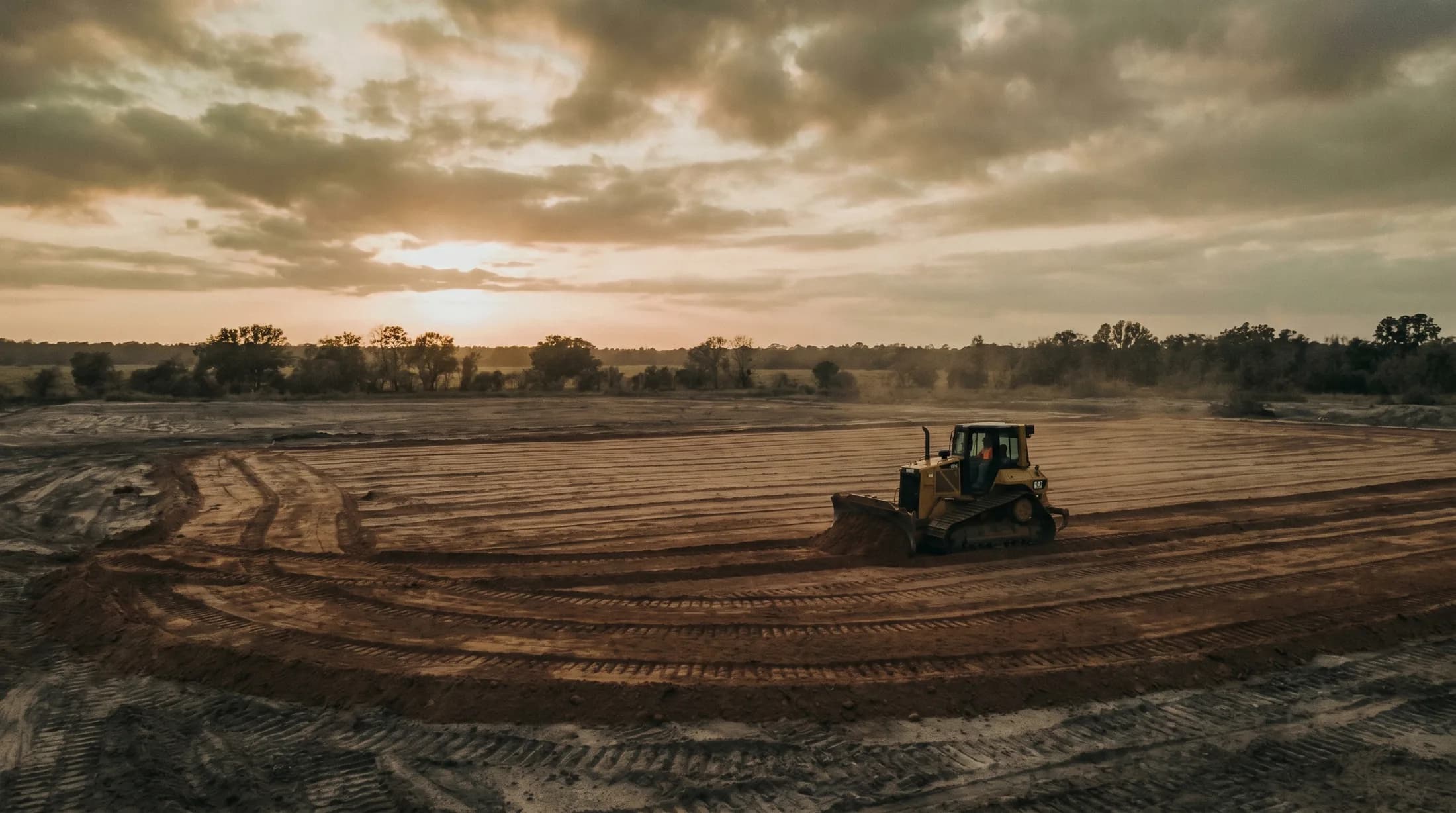Florida civil construction site with heavy equipment on freshly graded ground