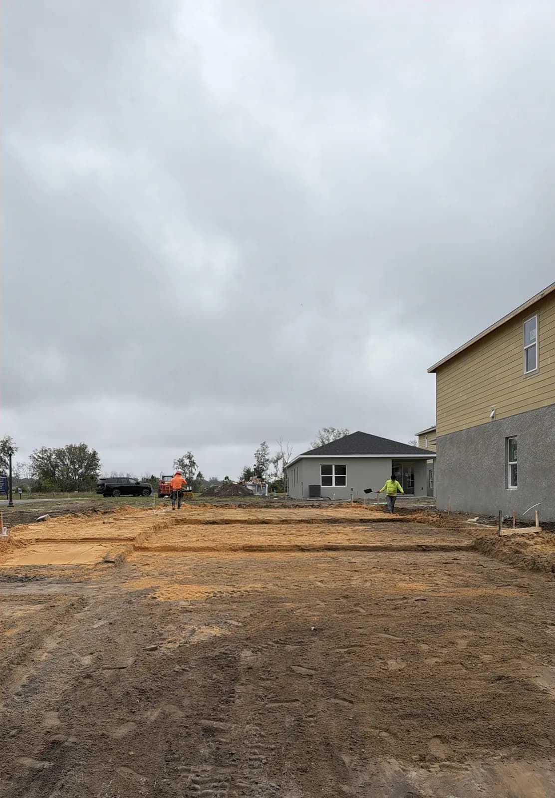 A freshly graded, build-ready pad on a cleared lot