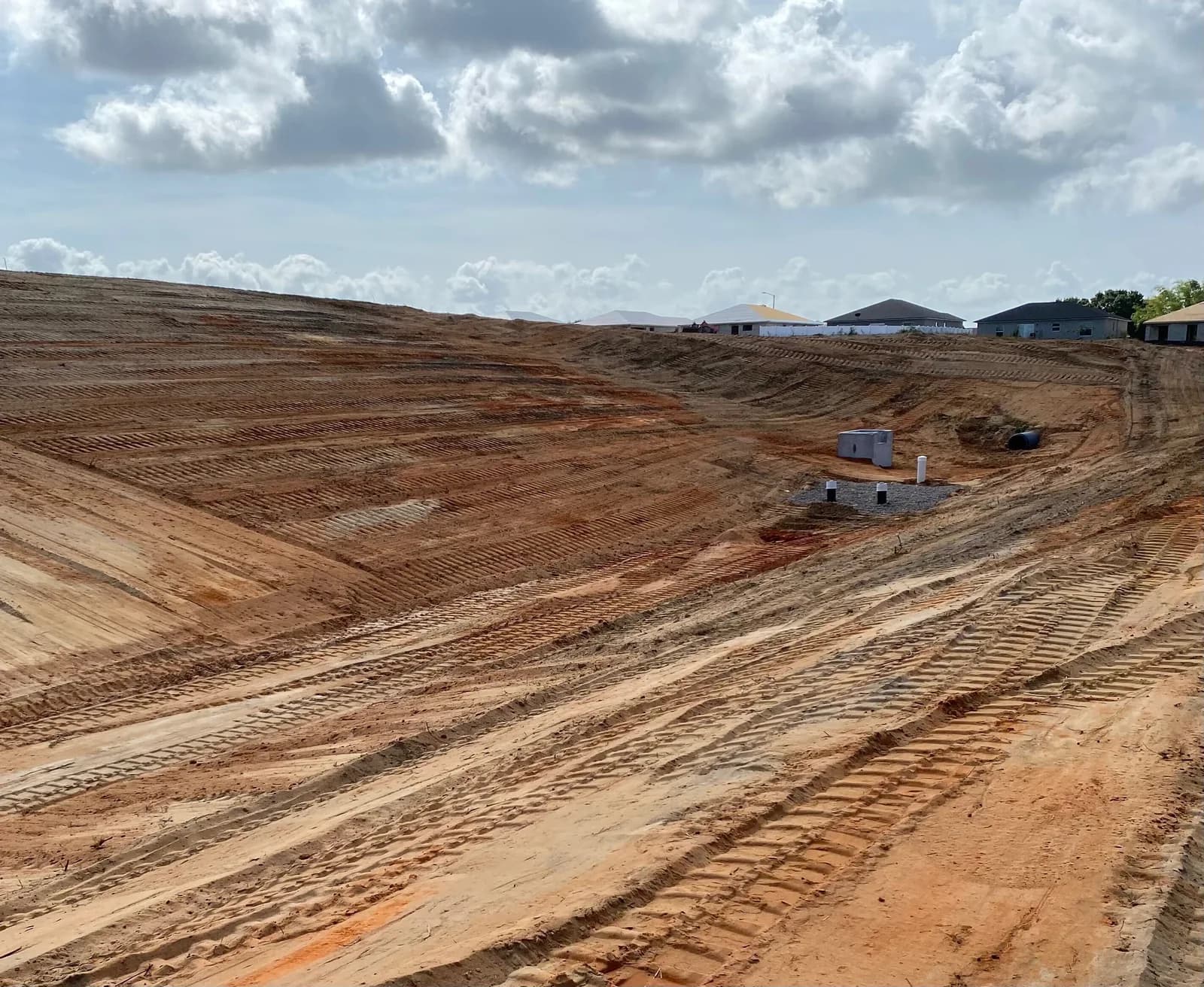 Graded stormwater retention pond with precast control structure